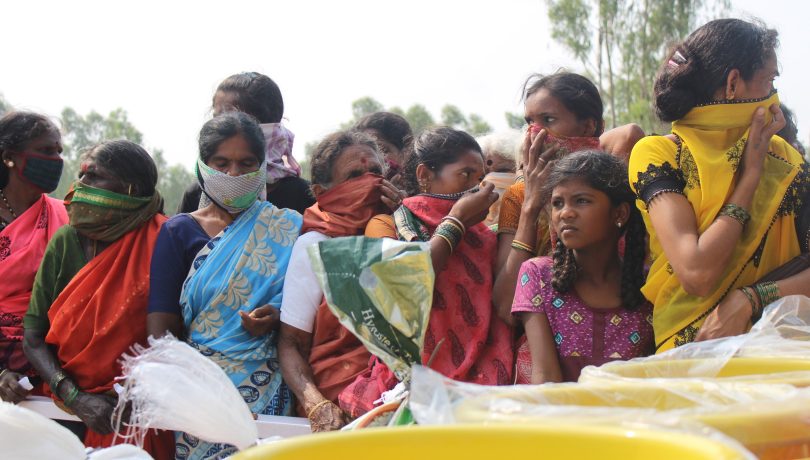 villagers waiting in line