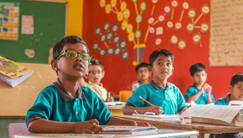 Shanti Bhavan curriculum - children sitting at their desks