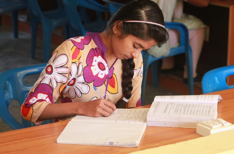 Volunteer - girl writing in notebook