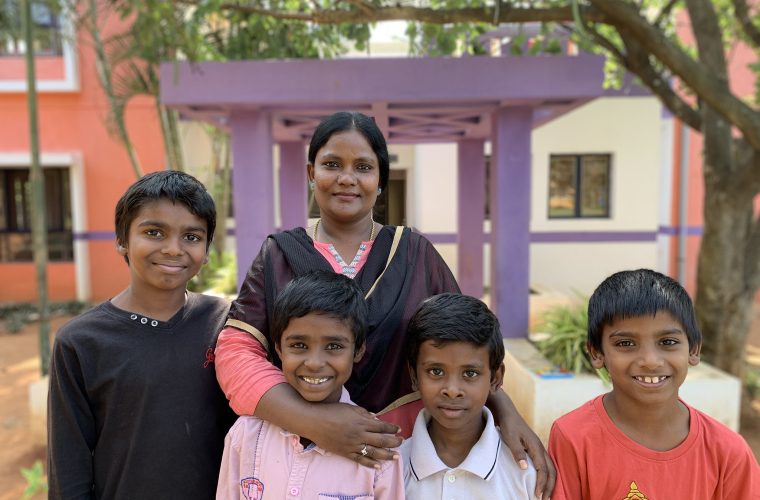 auntie and four children in front of shanti bhavan