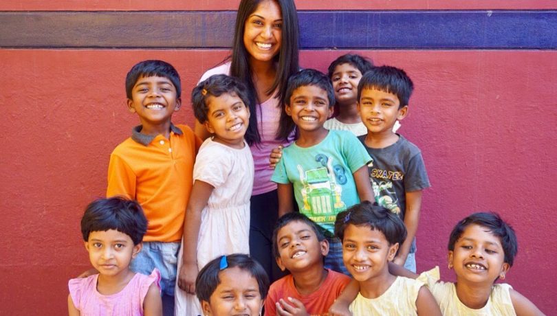 Meera, Shanti Bhavan volunteer, with children