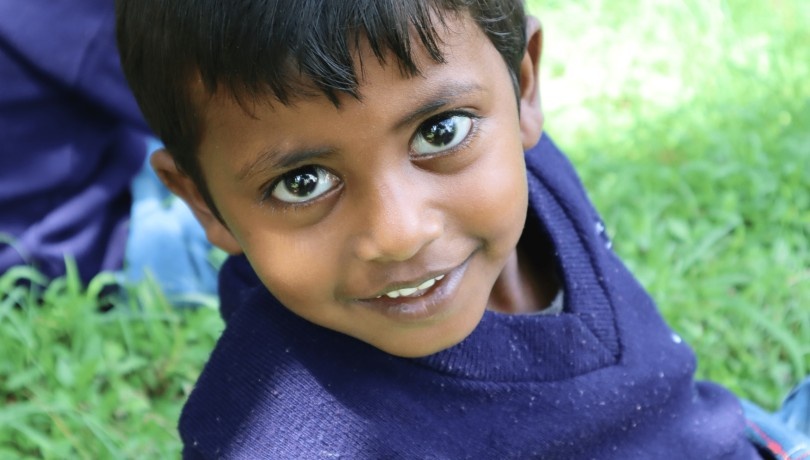 Boy sitting on the grass